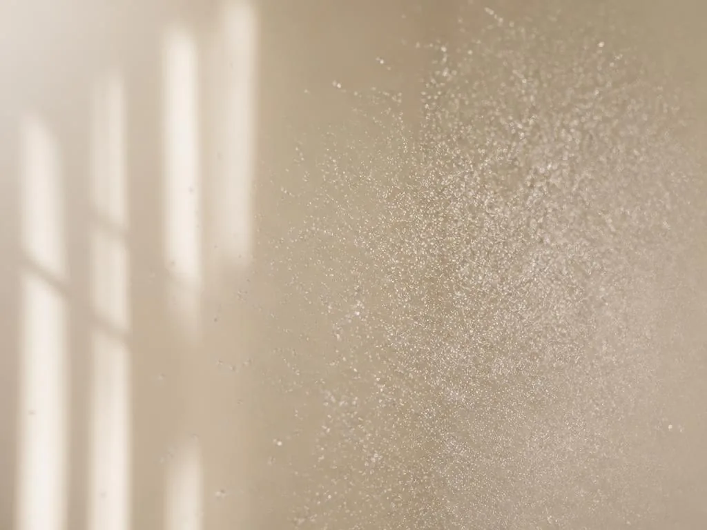 Fine Micro Glow mist burst floating in soft light